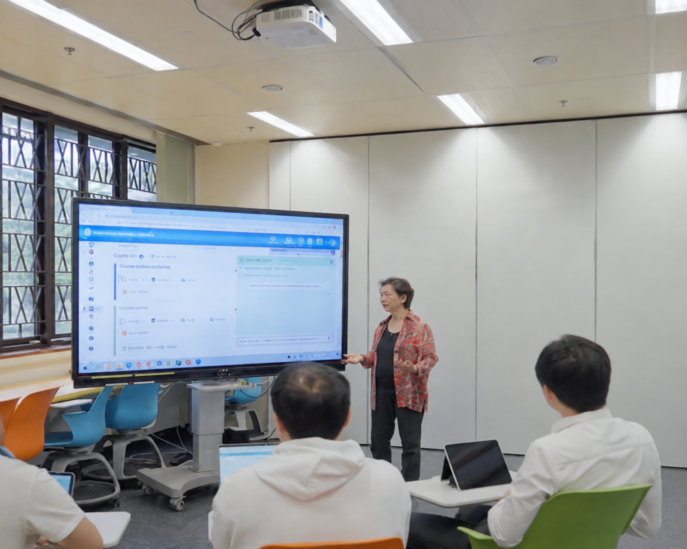 Teacher presenting analytics on large screen